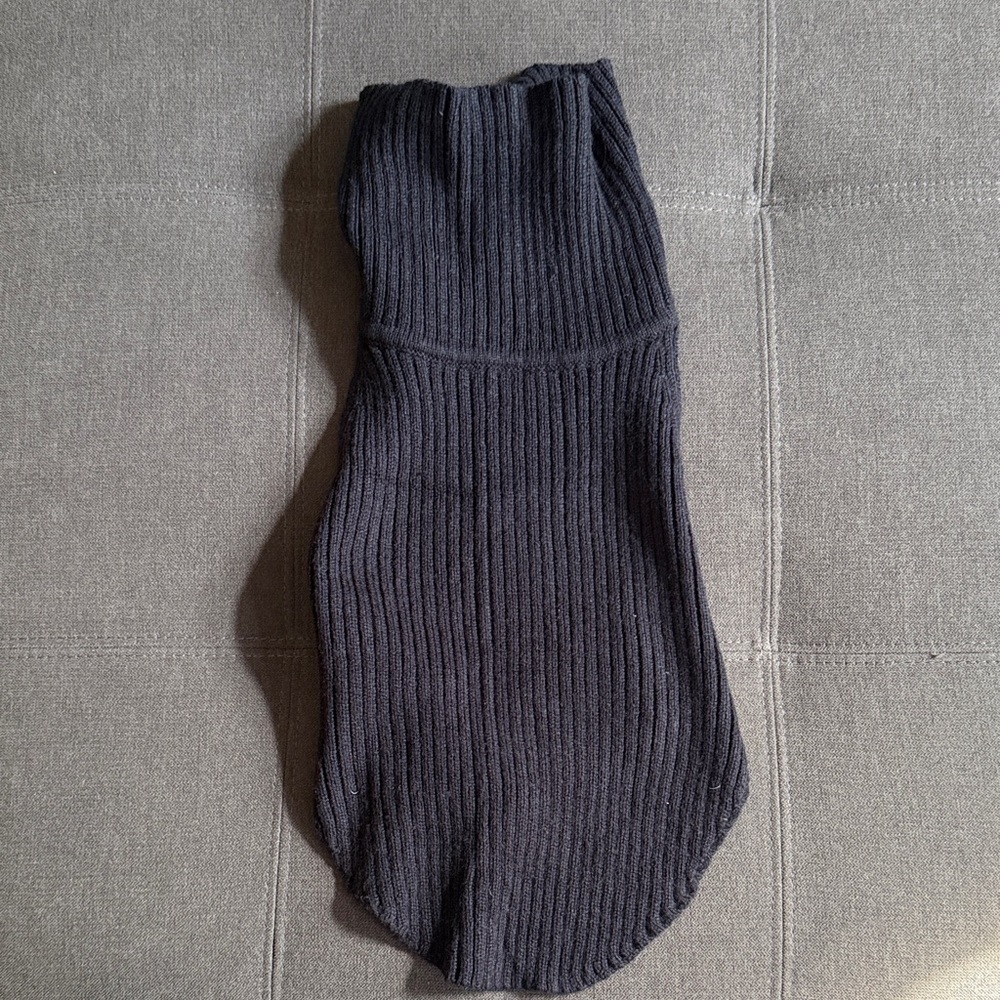 Black sleeveless turtleneck sweater